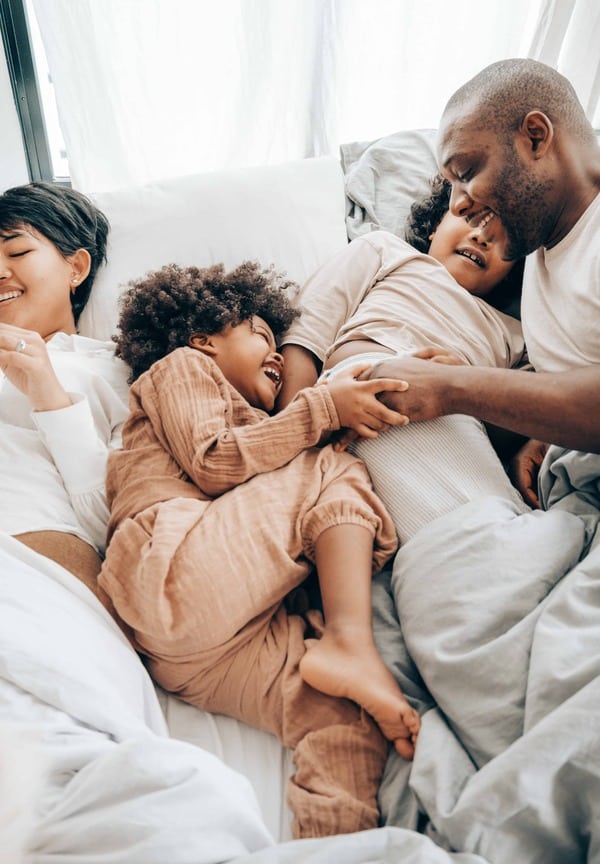 family-bed-laughing